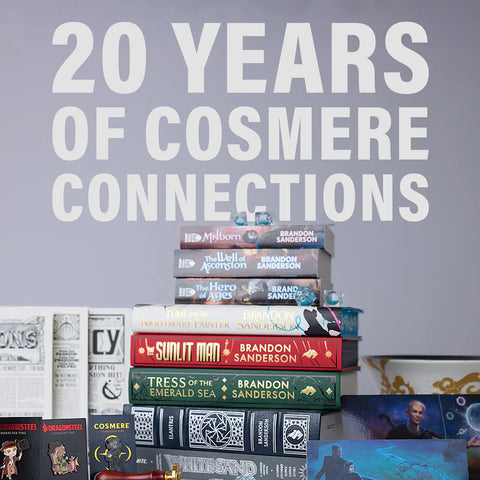 20 Years of Cosmere Connections: A stack of books and merchandise from Sanderson's Cosmere Universe.